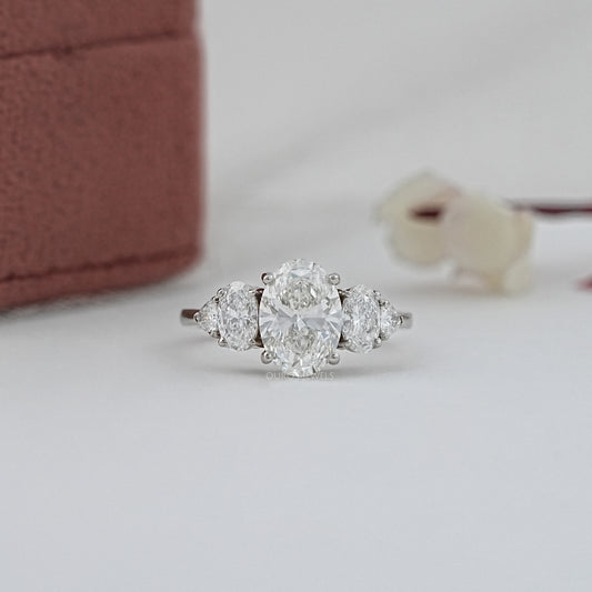 Oval And Trillion Curved Diamond Five Stone Engagement Ring